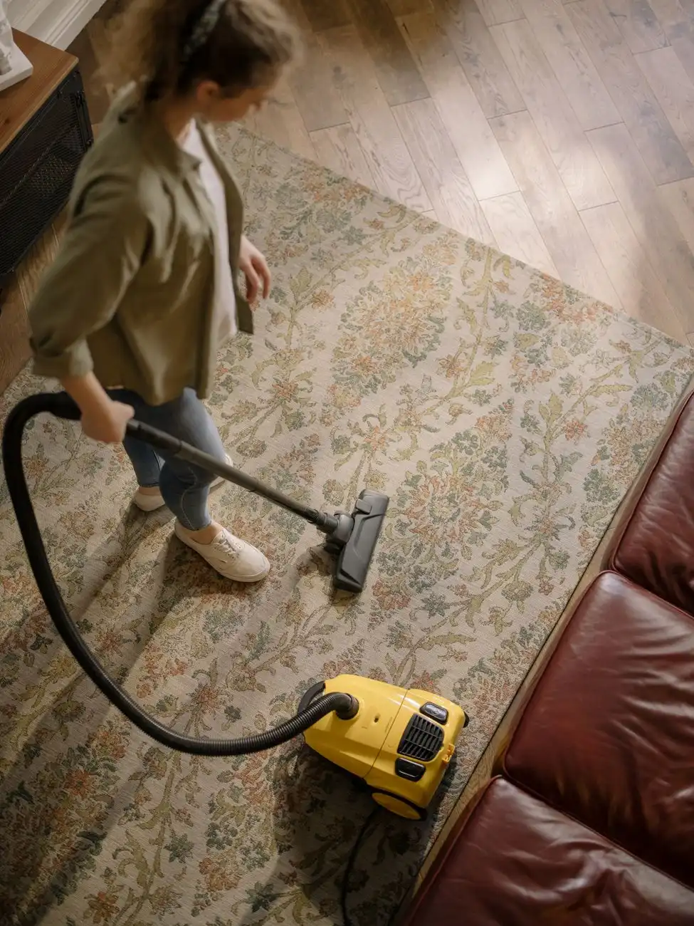 Deep-vacuuming an area rug at home