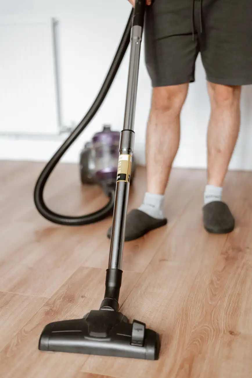 Vacuuming hard floors during a whole-home cleaning